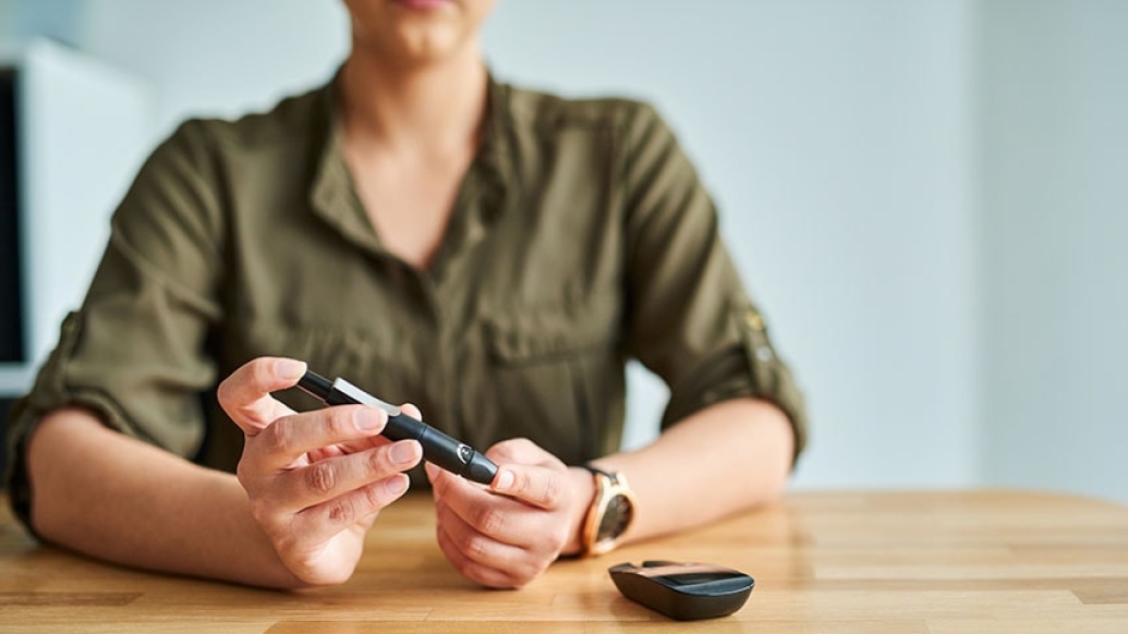 woman testing her blood sugar