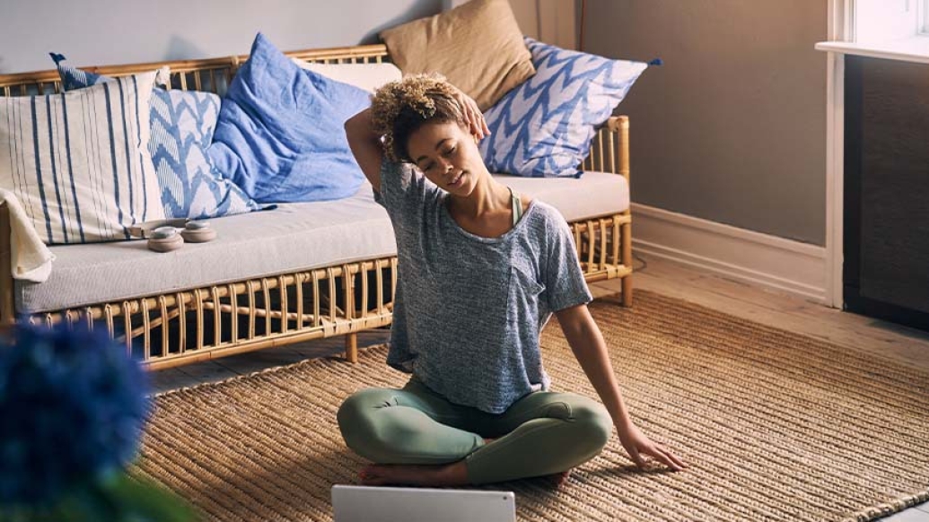 girl stretching neck while sitting