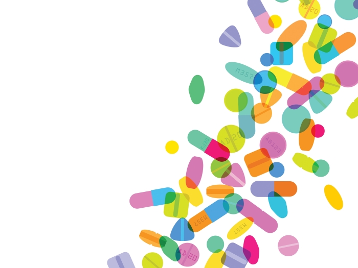 colorful pills falling in a line