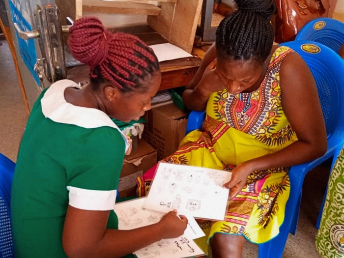 women sitting together looking at data 