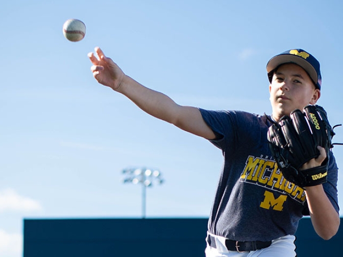  boy throwing baseball