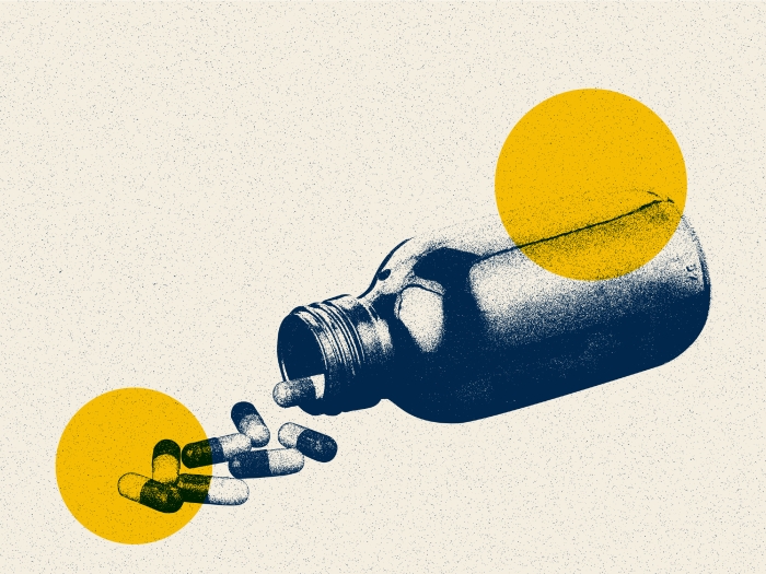 pill bottle spilling yellow blue