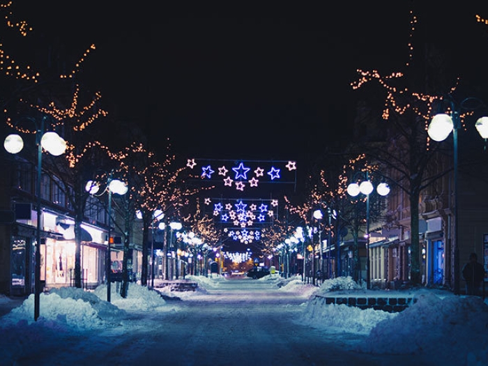 City street at night with holiday lights