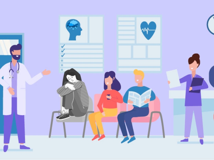 ER doctor talking to group in waiting room with teen in grey looking sad with legs hugged on chair