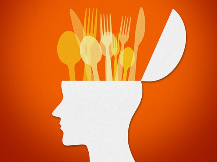 head with silverware coming out yellow red background