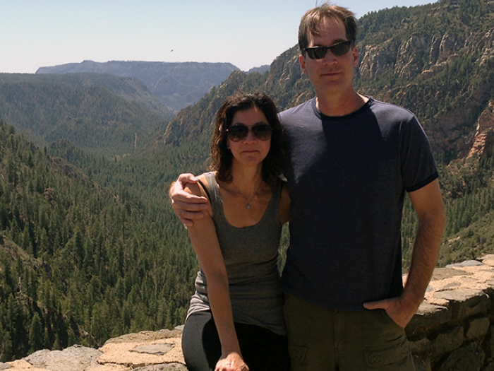 Dr. Stephen Chermack and his wife with mountains behind