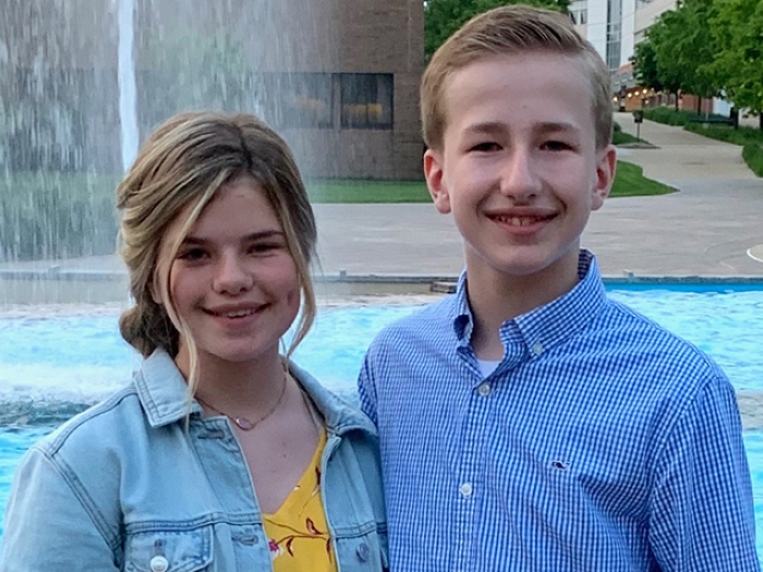 Kids standing by pool