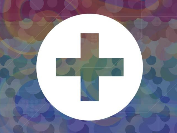 white health care cross image with rainbow color background