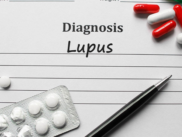 pills on paper with pen and lines to record height and weight