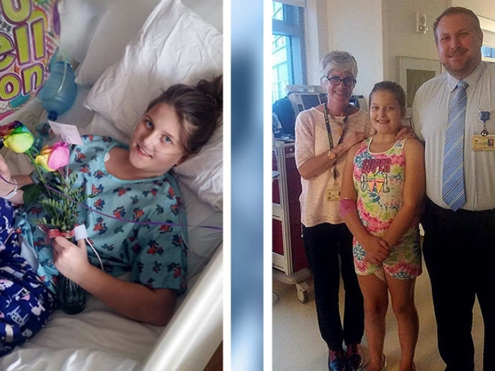 Girl in bed with flowers. Patient standing next to providers smiling.