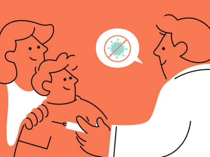 Mother with child and doctor receiving the Covid vaccine orange background