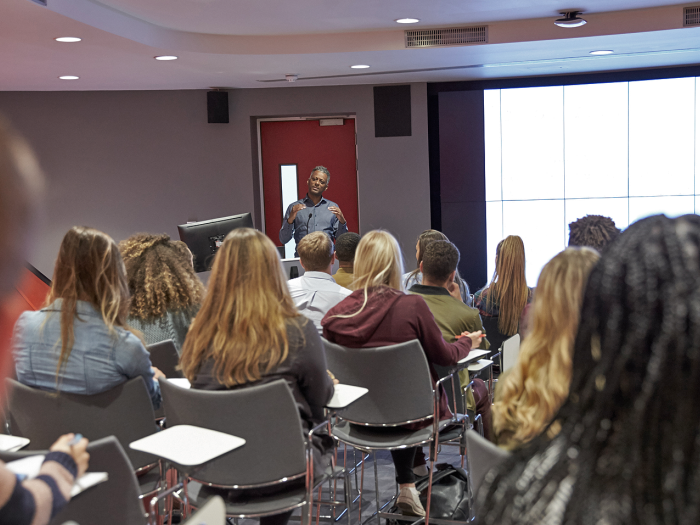 A postdoctoral fellow teaching a class as part of the IRACDA program