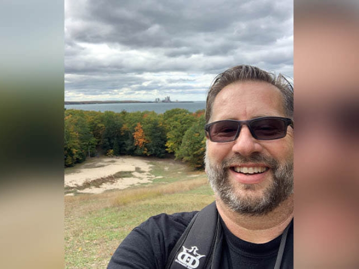 Scott Weston overlooking a lake