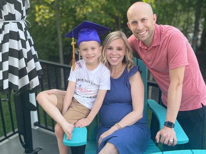 Smiling family outdoors on patio smiling