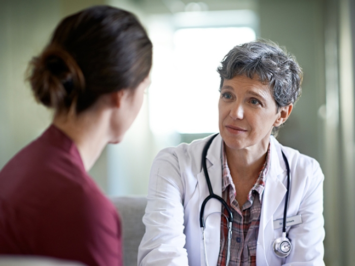 A breast cancer patient deciding whether to get implant reconstruction to autologous reconstruction