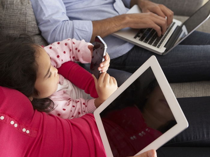 A family on their digital devices