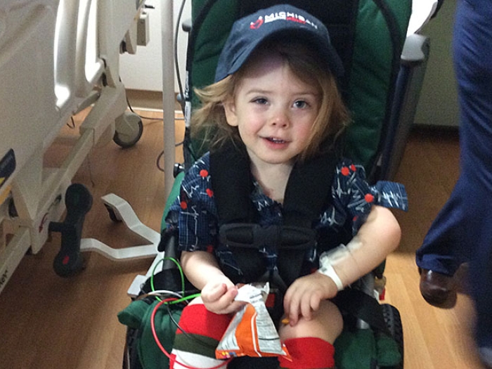 Little girl in wheel chair