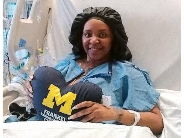 woman smiling hospital bed UM pillow