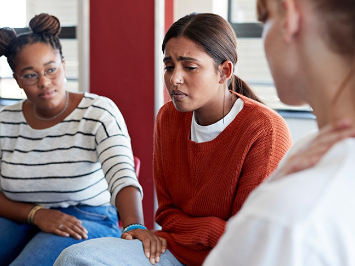 women crying sad therapy talk