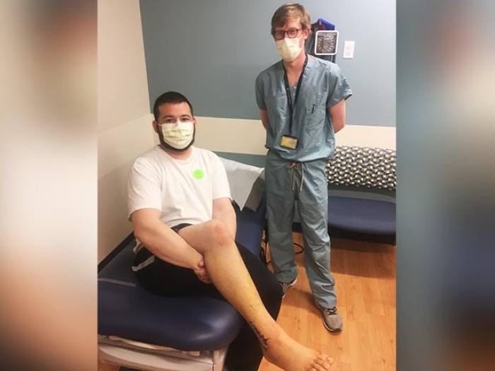 patient and doctor posing for photo