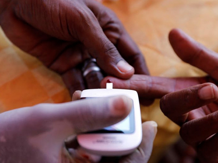 checking blood sugar on finger