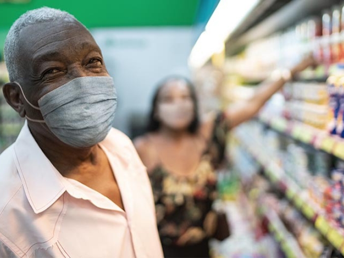 couple in super market getting groceries