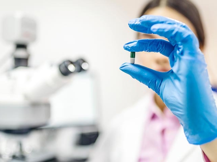 doctor with pill in hand