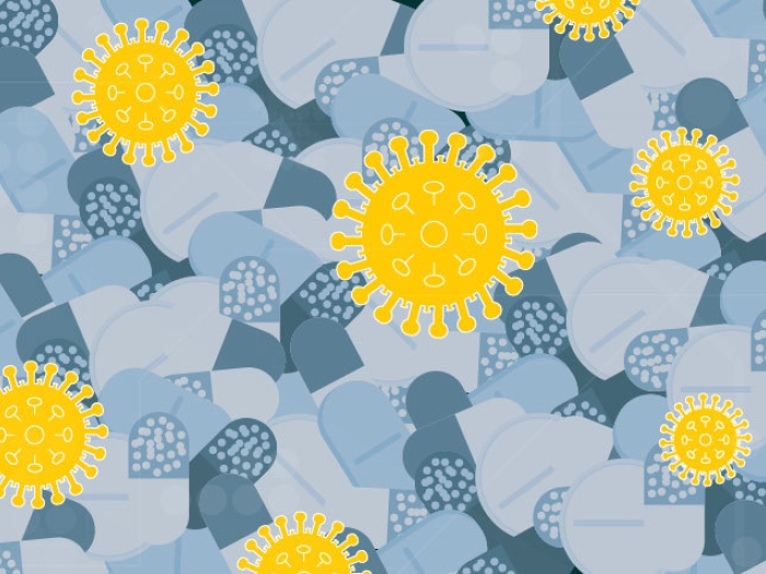 grey pills background with COVID-19 yellow cells popping out on top