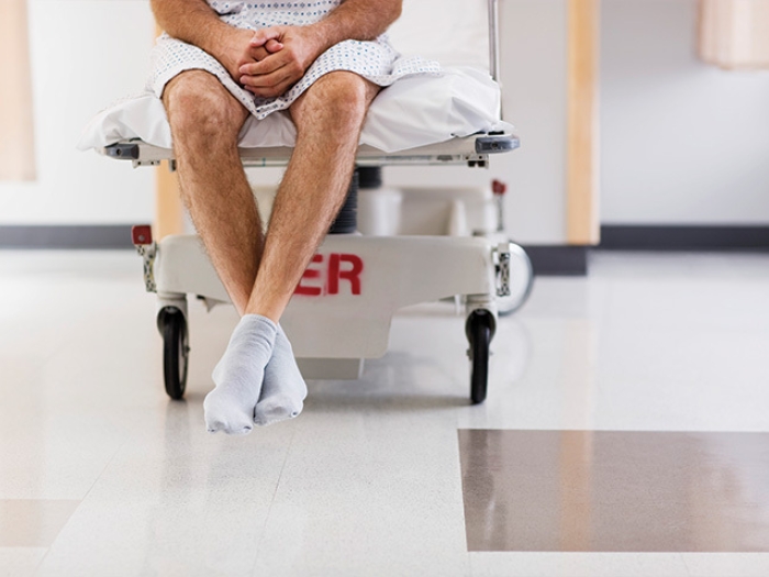 man legs hospital socks bed