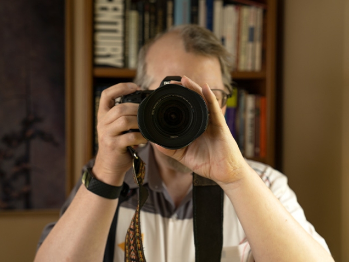 man taking photo with camera at camera