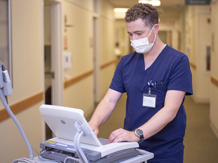 medical assistant in blue scrubs