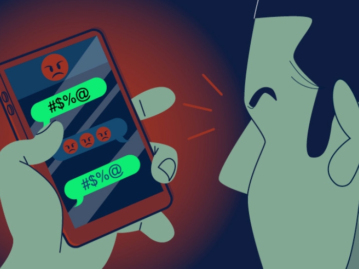 man looking at cell phone conversation with angry emoji in red and green