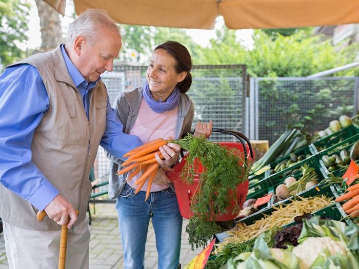 older adult at farmers market caregiver