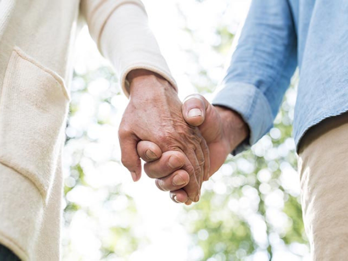 Couple holding hands