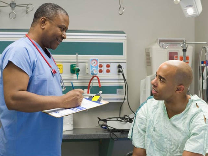 patient talking to physician in doctor's office