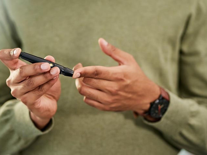 Person pricking finger