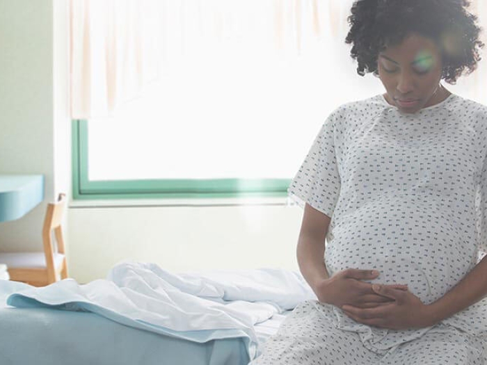 Pregnant women in hospital gown