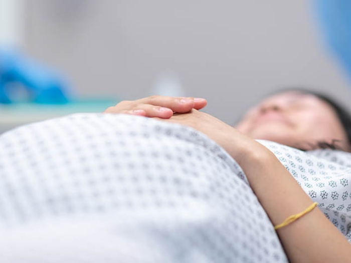 Pregnant woman on bed