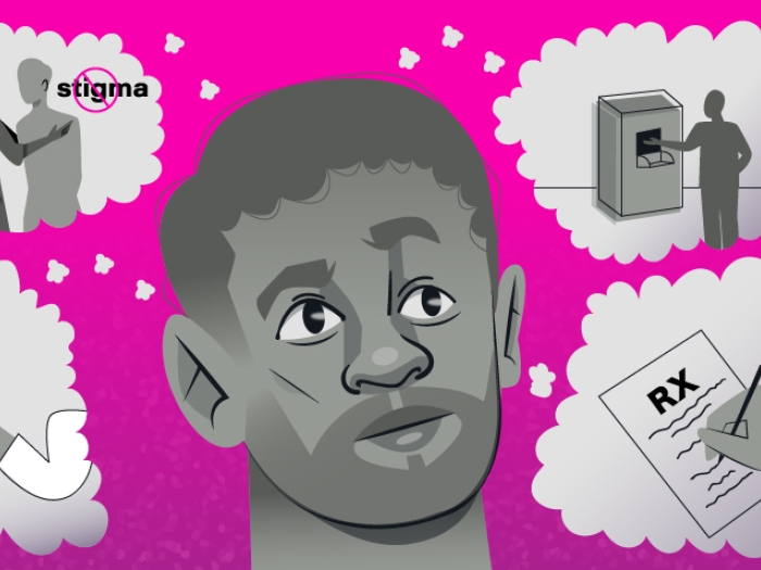 man looking at bubbles pink background