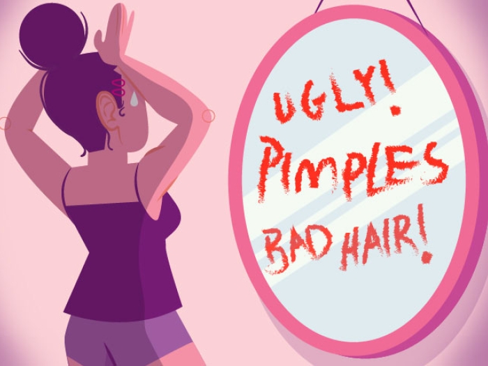 Girl looking in mirror reading ugly, pimples and bad hair