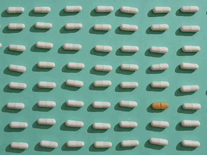 white brown pills on green background