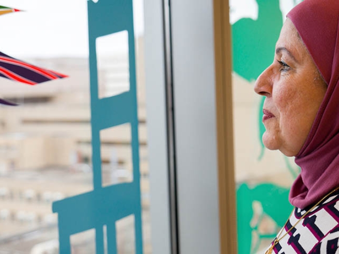 Woman looking out window