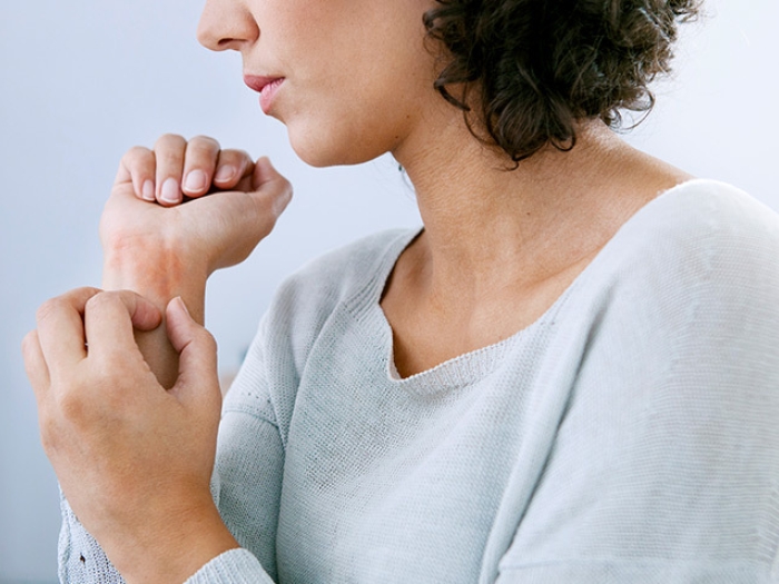 woman holding her wrist